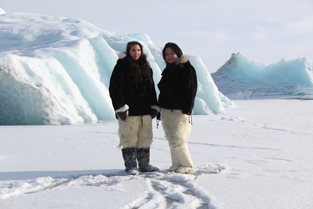 Pipaluk and Sara on the sea ice with polar bear pants
